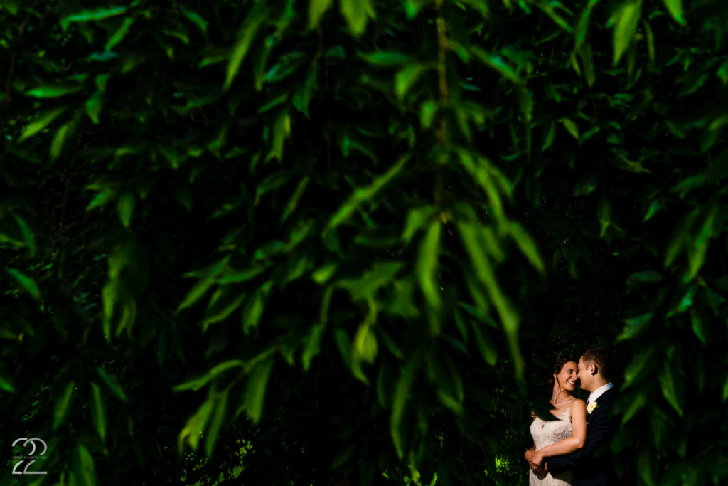 Husband and wife snuggle after wedding at French Park in Cincinnati by Cincinnati Wedding Photographer Studio 22 Photography